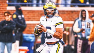 Next Story Image: Michigan's QB battle among many in Big Ten that will ramp up this fall